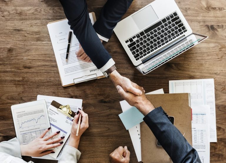 business-people-shaking-hands-together-1024x740